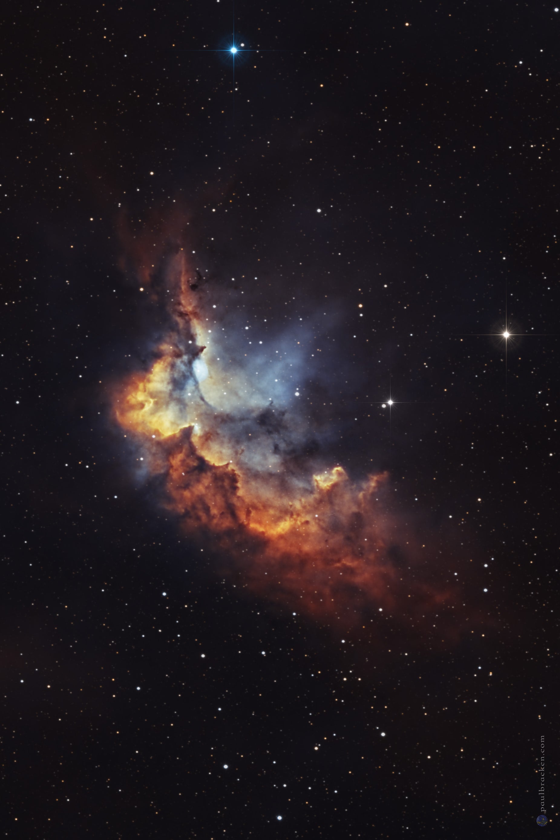 Star-forming region in space with a prominent nebula.